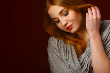 Fototapeta premium Portrait of blond winter beauty in light gray sweater