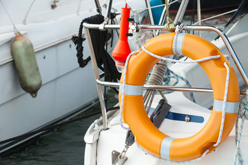 Modern yacht safety equipment, orange lifebuoy