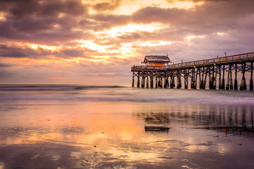 Fototapeta na wymiar Cocoa Beach, Florida, USA beach and pier at sunrise.