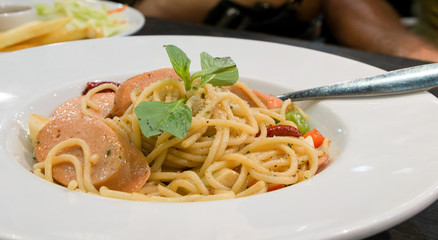 Spaghetti with basil, sausage and tomatoes noodles pasta meal