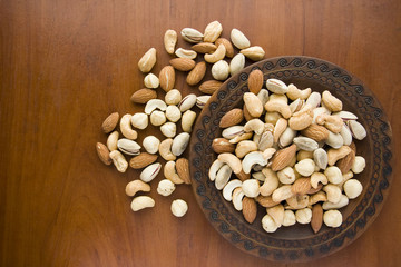Mix nuts in wooden plate