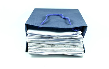 pile of documents in blue bag