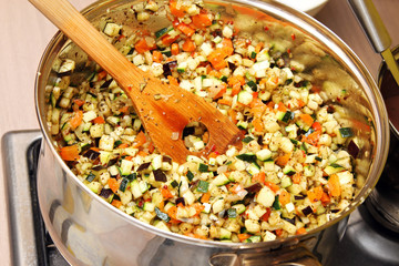 vegetables cooking in a pan on stove
