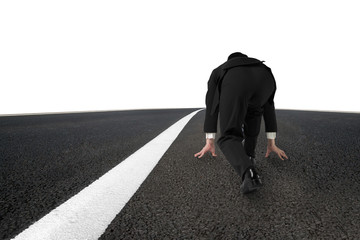 Businessman ready to run on asphalt road with white line