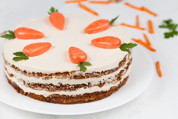 Delicious cheese cake with little carrots and cream op top