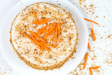 Delicious sponge cake with walnut and raisins on plate