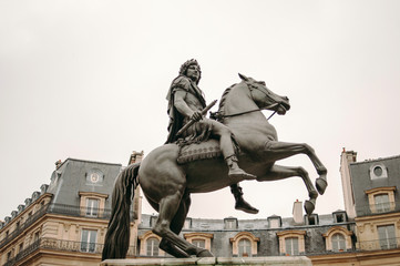 Fototapeta na wymiar Place des Victoires in Paris with the equestrian monument in hon