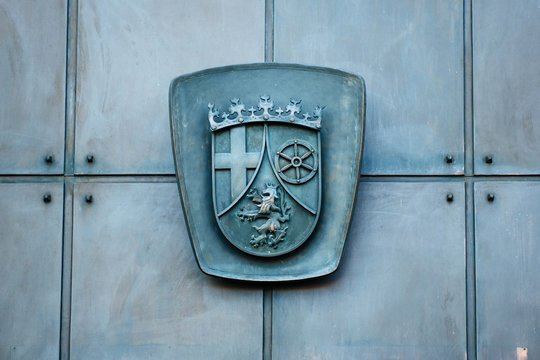 Relief carving on a metallic door - Caot of Arms