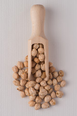Wooden scoop with chickpeas