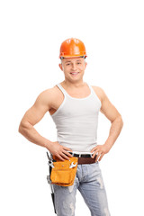 Handsome construction worker with a tool belt