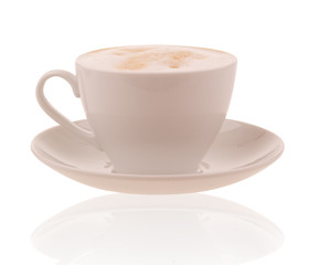 Coffee cup with cappuccino on brown background
