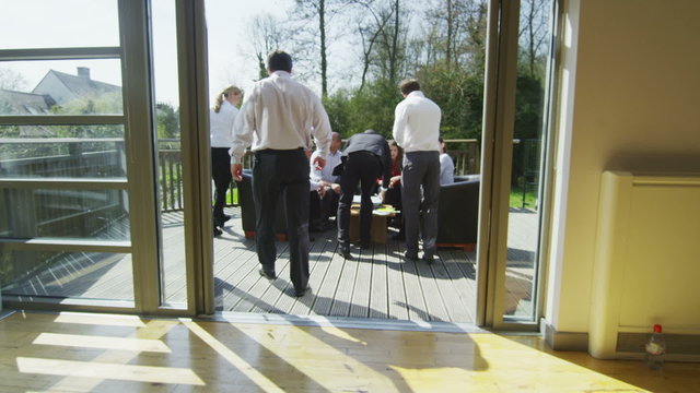 Business team meeting in office with natural outdoor area