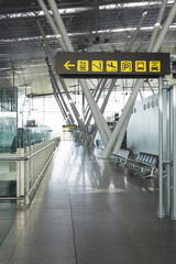 Signs in the hallway of an airport