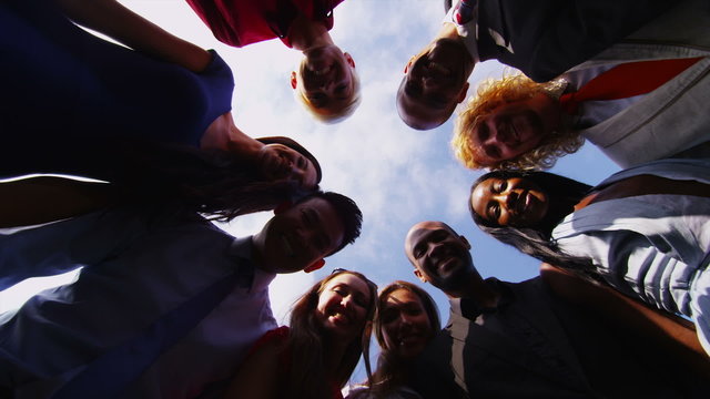 Business team stand in a circle with their hands together for a team talk