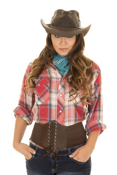 cowgirl red plaid shirt eyes look from under hat