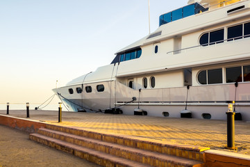 Luxury cruising yacht at pier