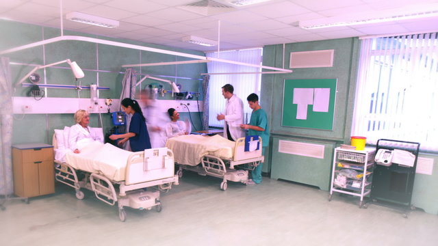 Time lapse of medical staff taking care of patients on a busy hospital ward