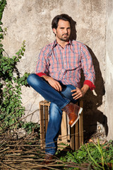 Male model sitting with legs crossed