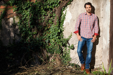 Male model sitting with legs crossed