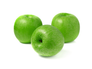Green apples on white background, focus on apple