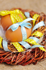 Easter eggs in the nest on a burlap