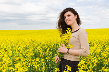 girl portrait in yellow flower field