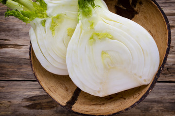Fennel in the bowl on the wood table. © gitusik