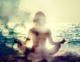 Woman Practicing Yoga by the Sea - 80473493