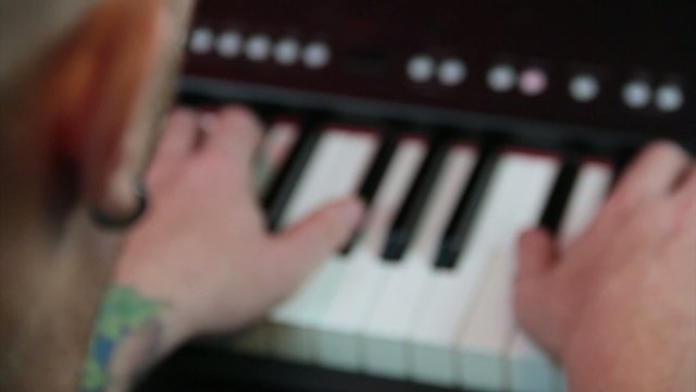 man playing the piano close up