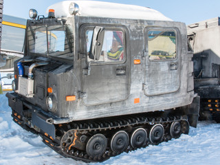 articulated military tracked cargo vehicle on snow