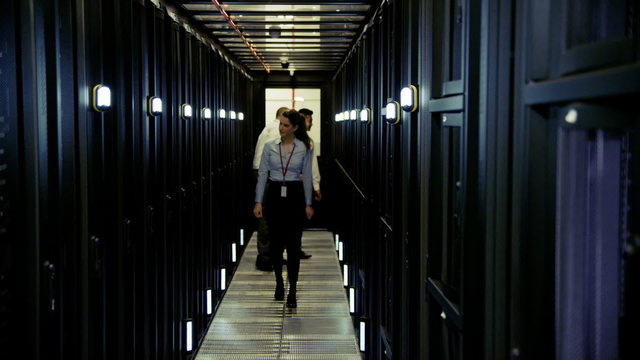 Team of IT engineers working in a data centre