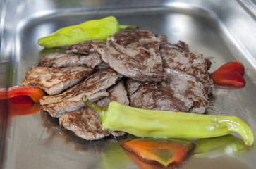 Slices of beef steak at restaurant buffet