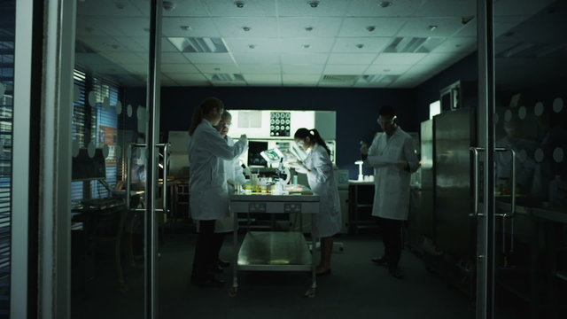 Workers within a busy medical or scientific research facility