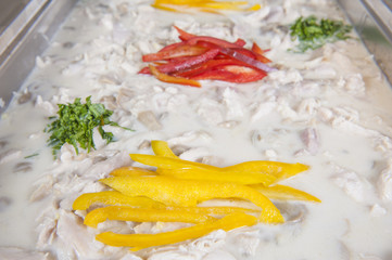 Chicken in white sauce at buffet