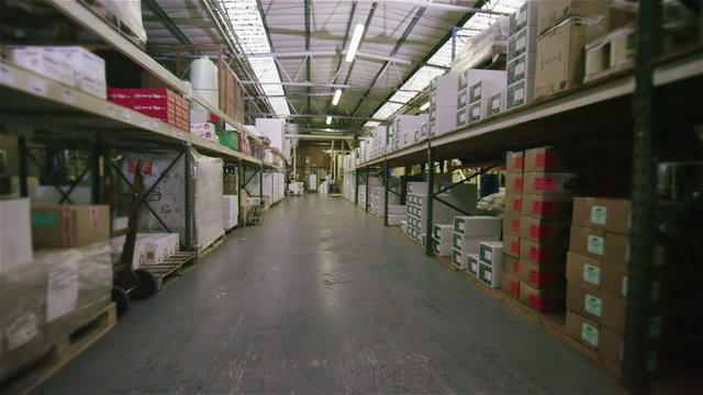 Interior view of an empty coffee distribution and processing plant. No people