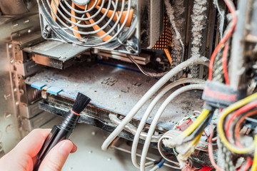 Cleaning your computer from dust with a brush