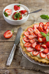 tart with cream and fresh strawberries