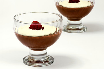 Homemade chocolate pudding with sour cream and strawberry