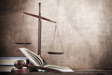 Legal. Golden scales of justice, gavel and books isolated on