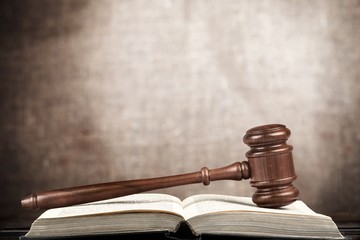Auction. Judge's hammer on wooden table