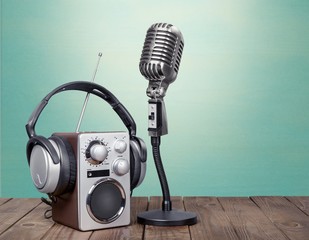 Wave. Retro radio, red microphone, headphones on table old style