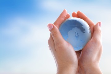 Globe. Hands holding Earth globe