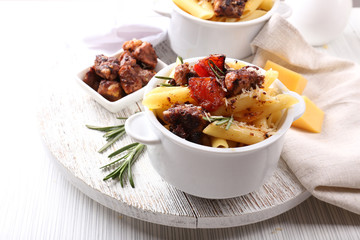 Tasty pasta with meat in ceramic pot