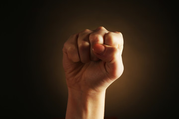 Obraz premium Female hand on dark background