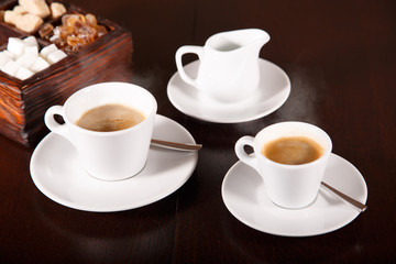 Coffee, milk and sugar on wooden surface , toned
