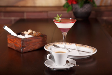 Italian dessert panna cotta with cup of coffee