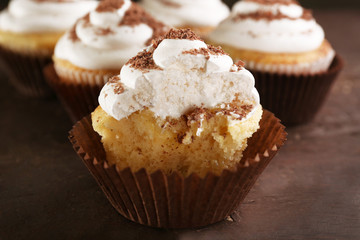 Delicious cupcakes on table close-up