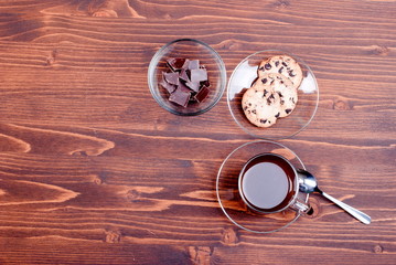 chocolate chip cookies with coffee on the board top view