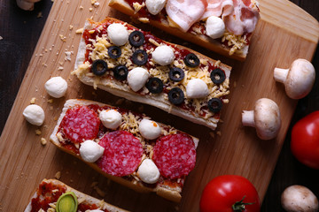 Different sandwiches with vegetables and cheese