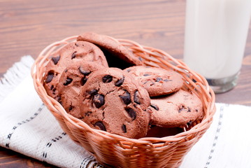 chocolate chip cookies with milk on the board top view
